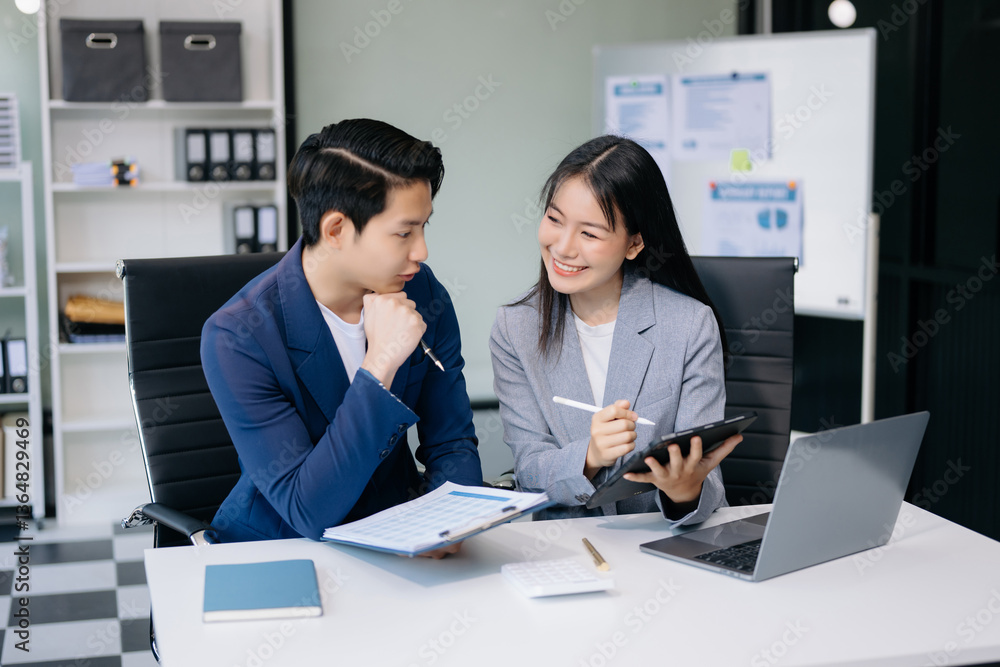 Portrait of success business people working together in office. Couple teamwork startup concept. Portrait of success business people working together in office. Couple teamwork startup concept.