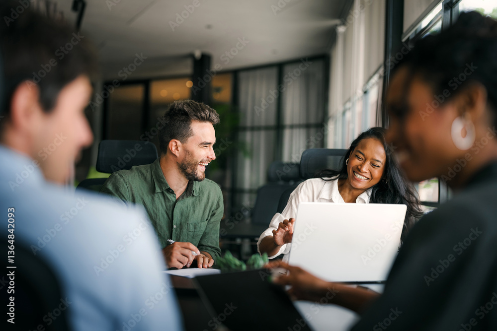 Group of young multi-ethnic startup business team collaborating on project in modern office