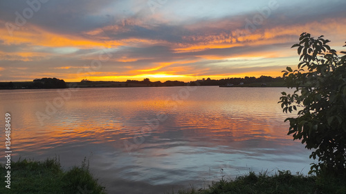 Photos Nature’s beauty captured in a tranquil lake view with the sun setting over the h