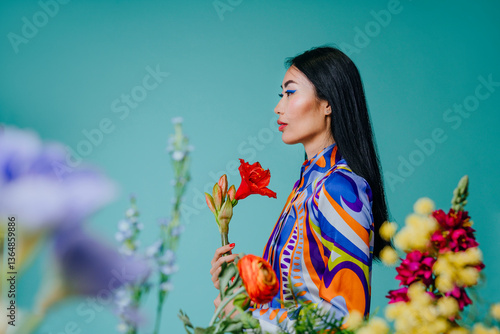 Woman in colorful clothing holding flowers in a vibrant spring setting