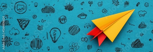 Vibrant Yellow and Red Paper Airplane on Textured Blue Background with Doodle Sketches Conveying Motion and Creativity