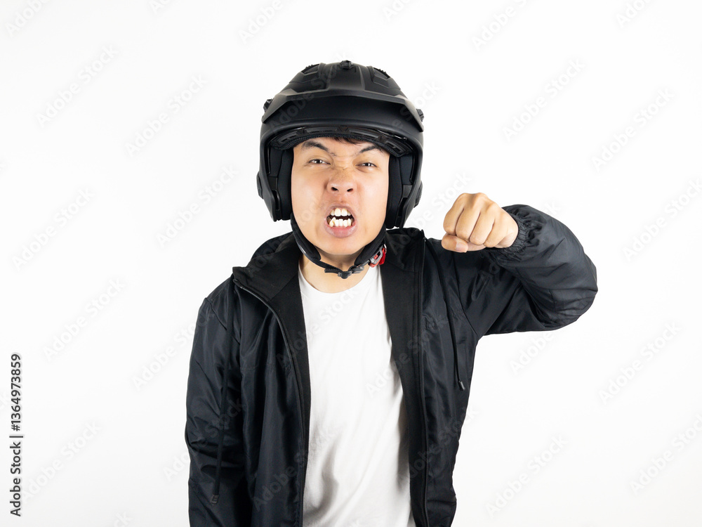Asian man wearing motorcycle helmet with angry and upset expression on white background Asian man wearing motorcycle helmet with angry and upset expression on white background