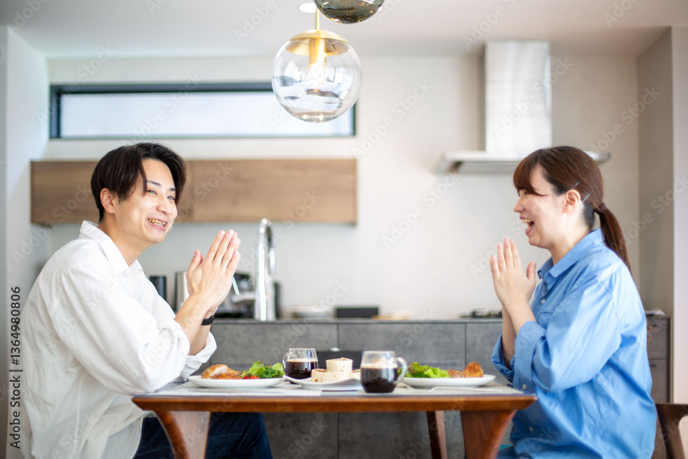 A young Japanese couple enjoying a holiday lunch A young Japanese couple enjoying a holiday lunch