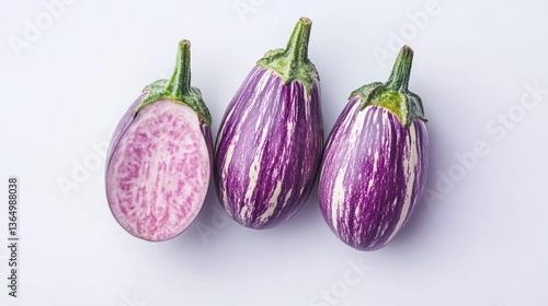 Wallpaper Mural Fresh purple striped eggplants, sliced, on white background; food photography Torontodigital.ca