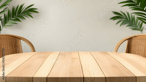 Empty wooden table with wicker chairs and palm leaves