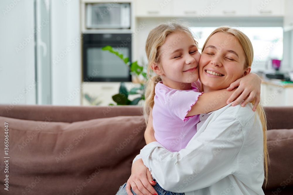 Mother and daughter sharing a joyful hug at home Mother and daughter sharing a joyful hug at home