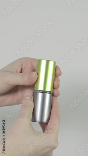 Vertical video of woman opening retractable face brush for powder or blush. Beauty and make up concept. Close up, 4k footage.