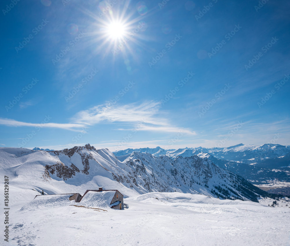 winter landscape at Nebelhorn mountain Oberstdorf, snowbound alpine hut. bright sunshine.