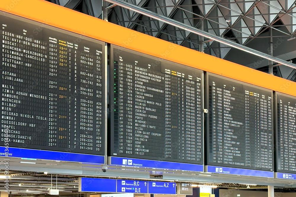 Flight Departures information board, airport terminal with passengers checking flights, large departure board displays destinations travelers airport departure hall, Frankfurt Flight Departures information board, airport terminal with passengers checking flights, large departure board displays destinations travelers airport departure hall, Frankfurt