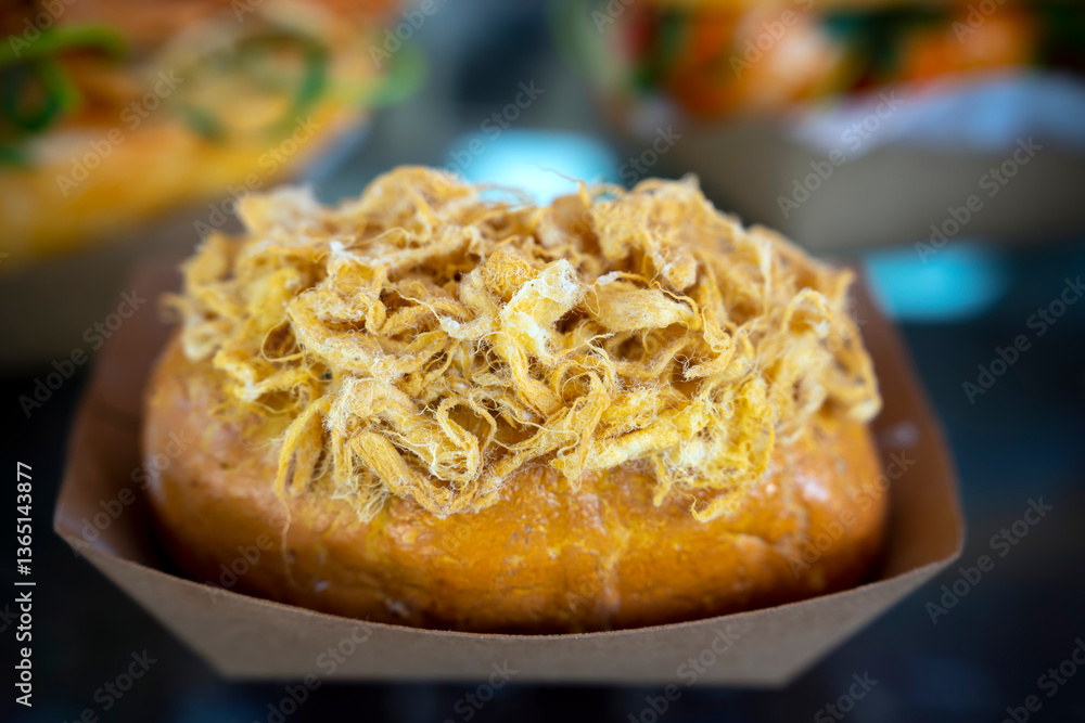 Homemade bun of bread with mayonnaise and pork floss on wood tray