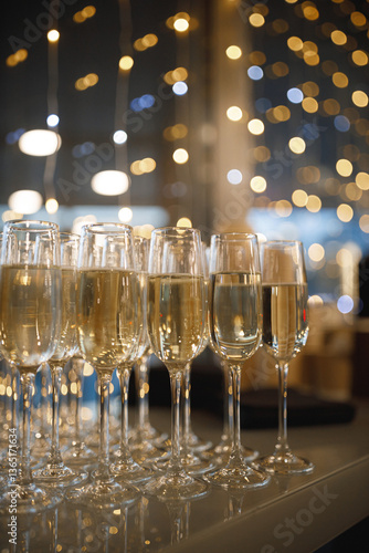Elegant champagne glasses are arranged on a table for a special occasion