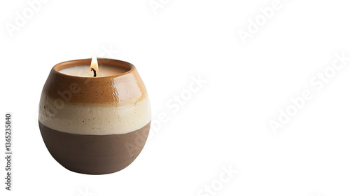 Elegant candle in a stylish ceramic holder.