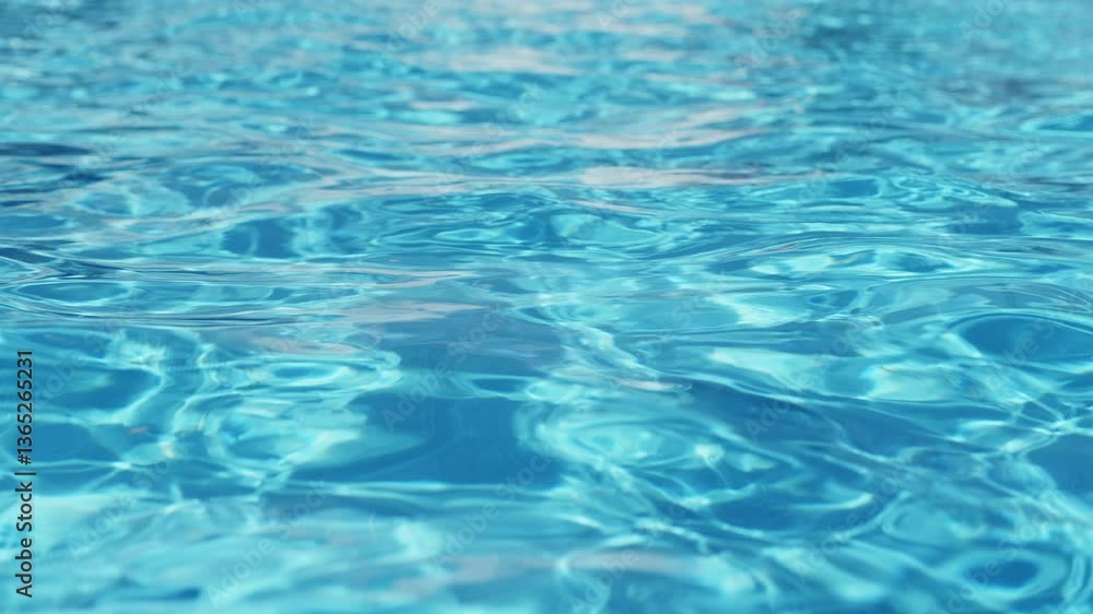 Ripples on the water of the pool. Transparent, sparkling and inviting surface of the water in motion. View from above. slow motion and looped video. Ripples on the water of the pool. Transparent, sparkling and inviting surface of the water in motion. View from above. slow motion and looped video.