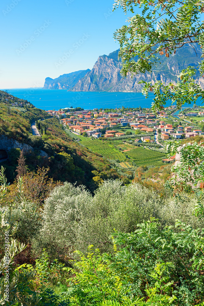 view from lookout point to lake Gardasee and tourist resort Torbole, italy