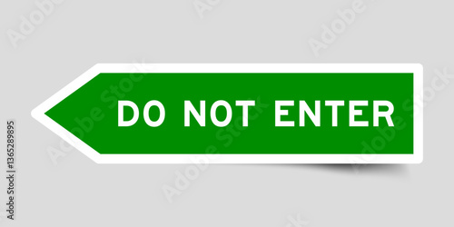 Green color arrow shape sticker label with word do not enter on gray background