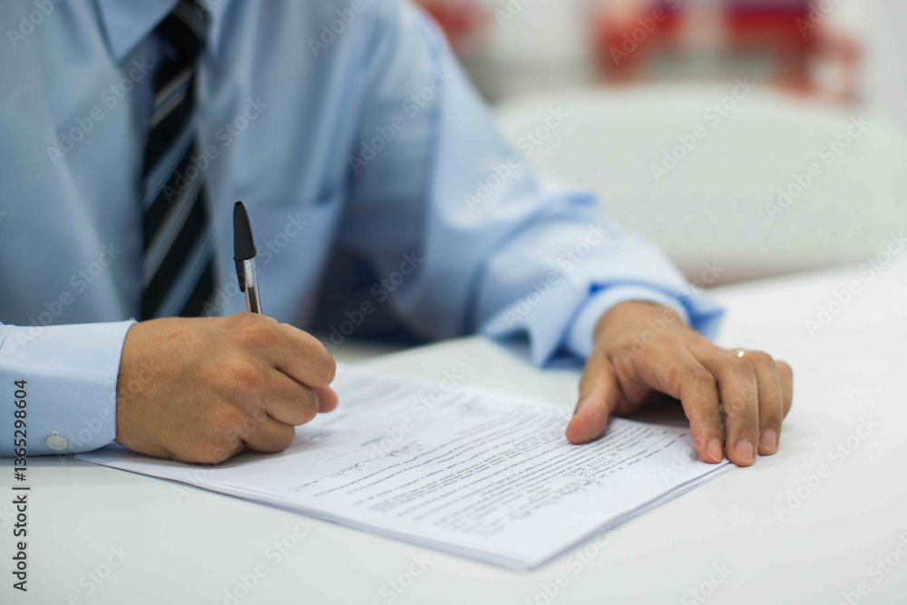 Fototapeta premium Crop shot of a business person with pen signing document