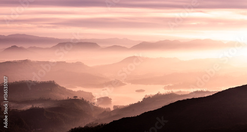 View from Adam's peak, Sri Lanka. Valley view with lakes and mountains at sunrise.