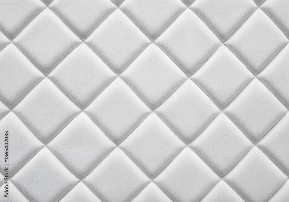 Naklejka premium White leather upholstery with a quilted diamond pattern and seamless texture