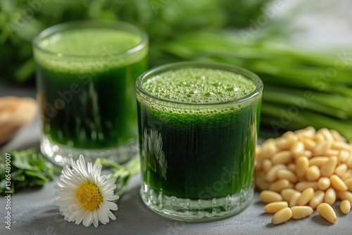 Refreshing Green Juice Served in Glasses Garnished With Herbs and Nuts in a B...