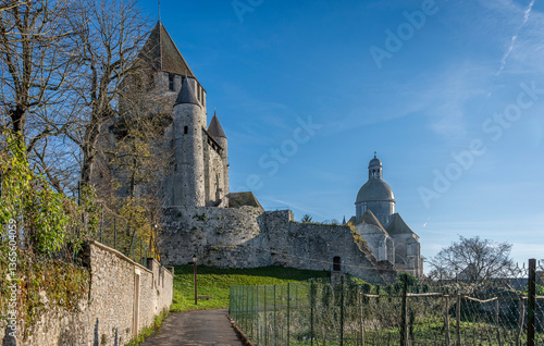 Provins, France - 11 30 2024: Panoramic view of the Caesar Tower and Saint-Quiriace collegiate church in the Medieval City .