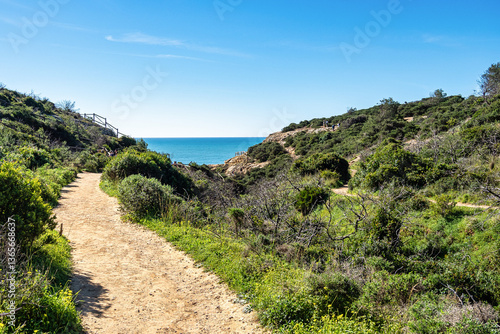 Praia da Marinha Beach among rock islets and cliffs seen from Seven Hanging Valleys Trail, Algarve, Portugal