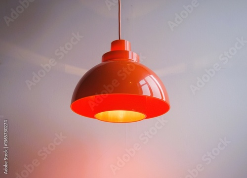 Orange retro lamp in plastic from the 1970s.