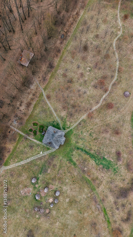 Aerial landscape of a romanian old village household in the Carpathians, Transylvania, Romania, Europe