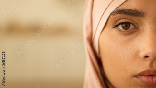Close up health problem pensive peaceful half female face at home Muslim woman in hijab Islamic girl look Islamic lady Islam religion in headscarf looking at camera serious discrimination religion