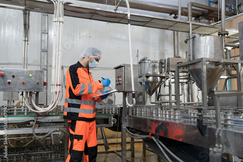 Canned fish factory, seafood manufacturing and food processing. Conveyor belt and production engineer. Plant engineer inspecting quality, repairing, maintenance of seafood processing conveyor belts