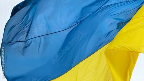 Highly detailed fabric texture flag of Ukraine. Slow motion of Ukraine flag waving background sky blue and yellow national color Ukrainian yellow-blue. Ukraine flag wind waving national symbol country