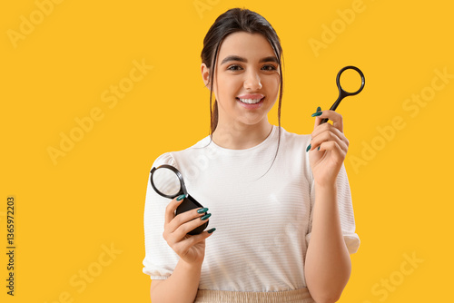 Young woman with magnifiers...