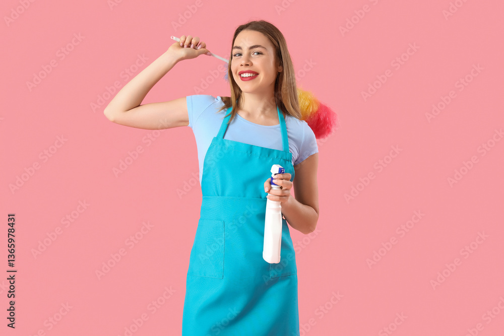 Young woman with bottle of detergent and pp-duster on pink background Young woman with bottle of detergent and pp-duster on pink background