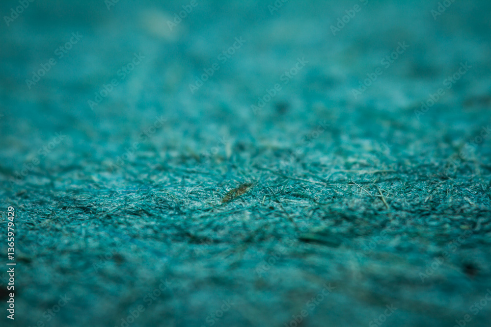 Extreme closeup of turquoise handmade paper with shallow depth of field. Extreme closeup of turquoise handmade paper with shallow depth of field.