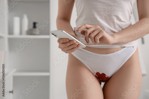 Menstruating woman with red...