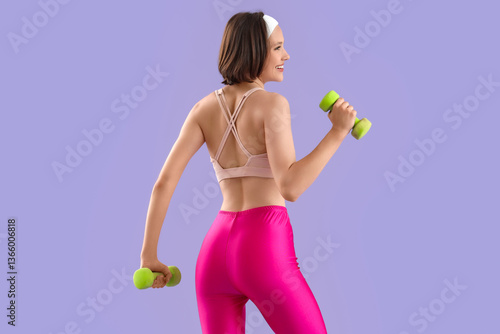 Young woman exercising with...