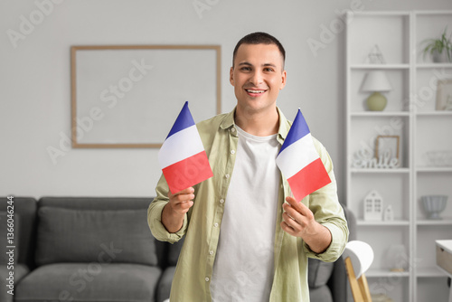 Young man with flags of Fra...