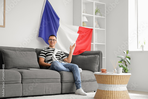 Young man with flag of Fran...