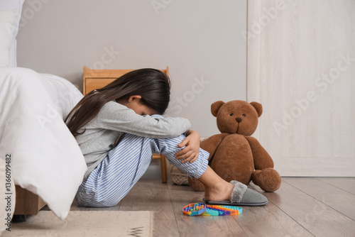 Sad girl with autistic diso...