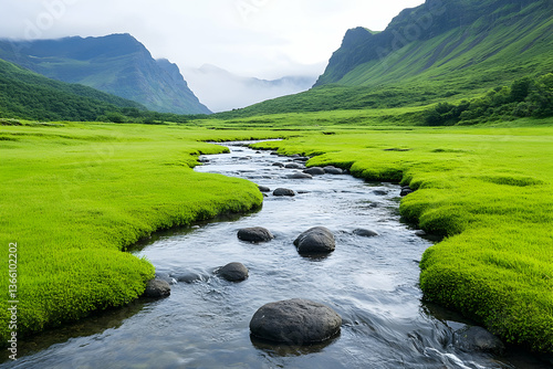 Wallpaper Mural Serene stream meanders through lush green valley, nestled between misty mountains Torontodigital.ca