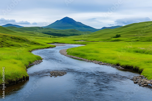 Wallpaper Mural Serene river meanders through lush green valley towards a majestic mountain under a cloudy sky Torontodigital.ca