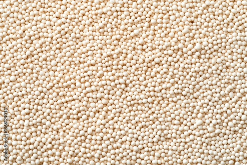Textured surface of tiny light seeds, showcasing natural pattern