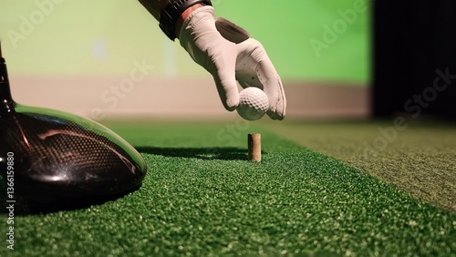 Fotografie Practicing golf swing technique indoors with a driving range simulator