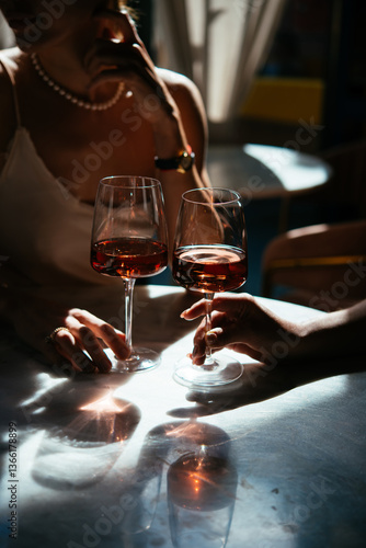 Glasses of rose wine seen during a friendly party or a celebration in a restaurant of a bar.