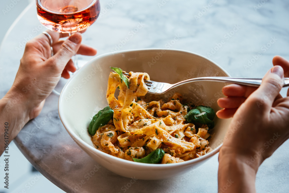 Having a pasta dinner at home or in a restaurant.