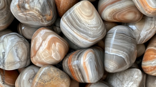 A close-up view of polished agate stones in shades of brown and gray, showcasing their intricate bands and patterns, ideal for geology or natural decor themes.. AI Generation