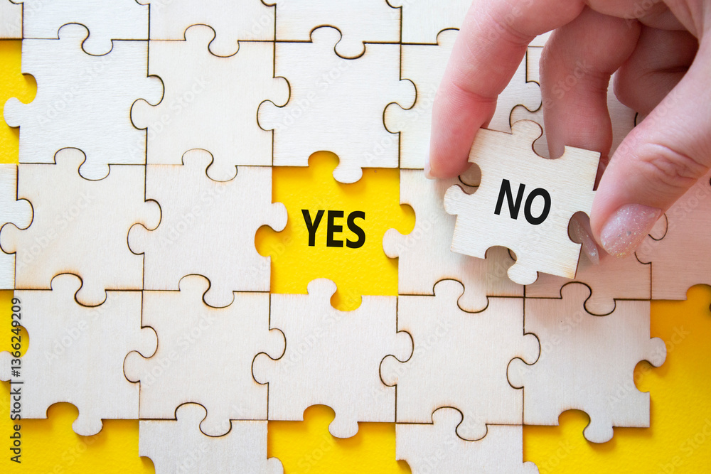 Fototapeta premium Yes or No symbol. Concept word Yes or No on wooden puzzle. Businessman hand. Beautiful yellow background. Business and Yes or No concept. Copy space