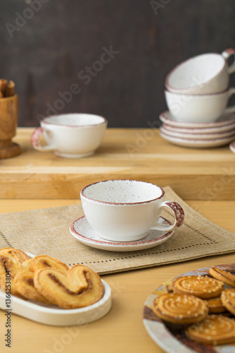 Ceramic teacup and saucer set on kitchen table