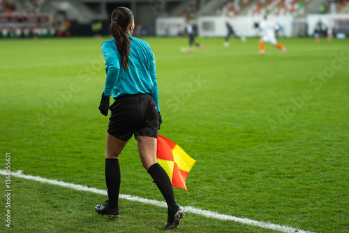 Obraz na płótnie Woman assistant of football referee during the match. w salonie