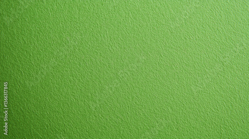 A close-up of a textured green surface, showcasing a smooth and vibrant appearance, ideal for backgrounds or design elements.