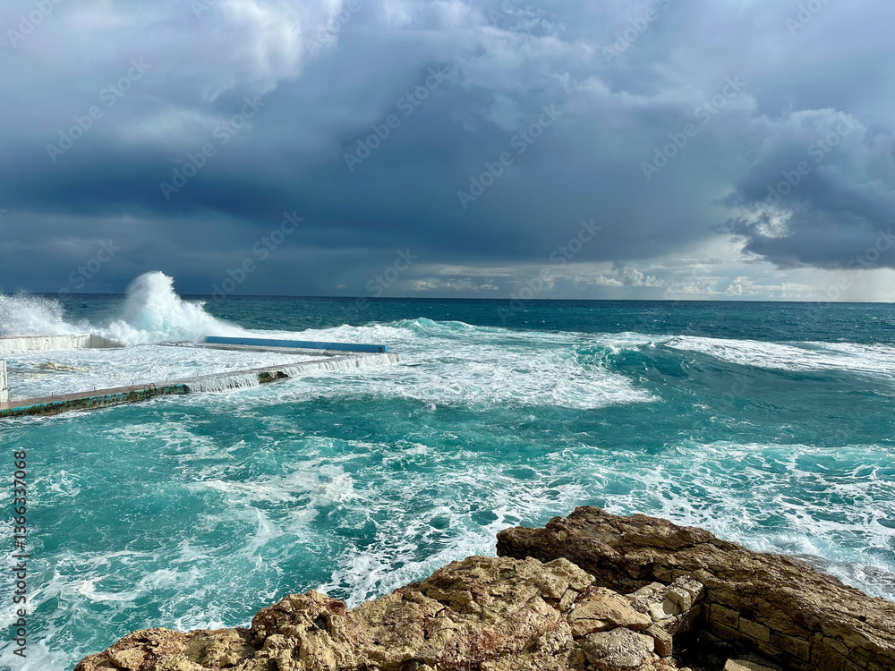 Storm in the Mediterranean Sea and waves crashing on the beach in Sliema, Malta